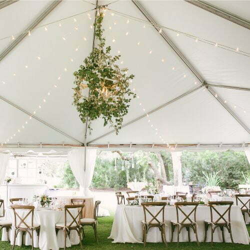 Tented full service catered Event in Charleston with tables and chairs